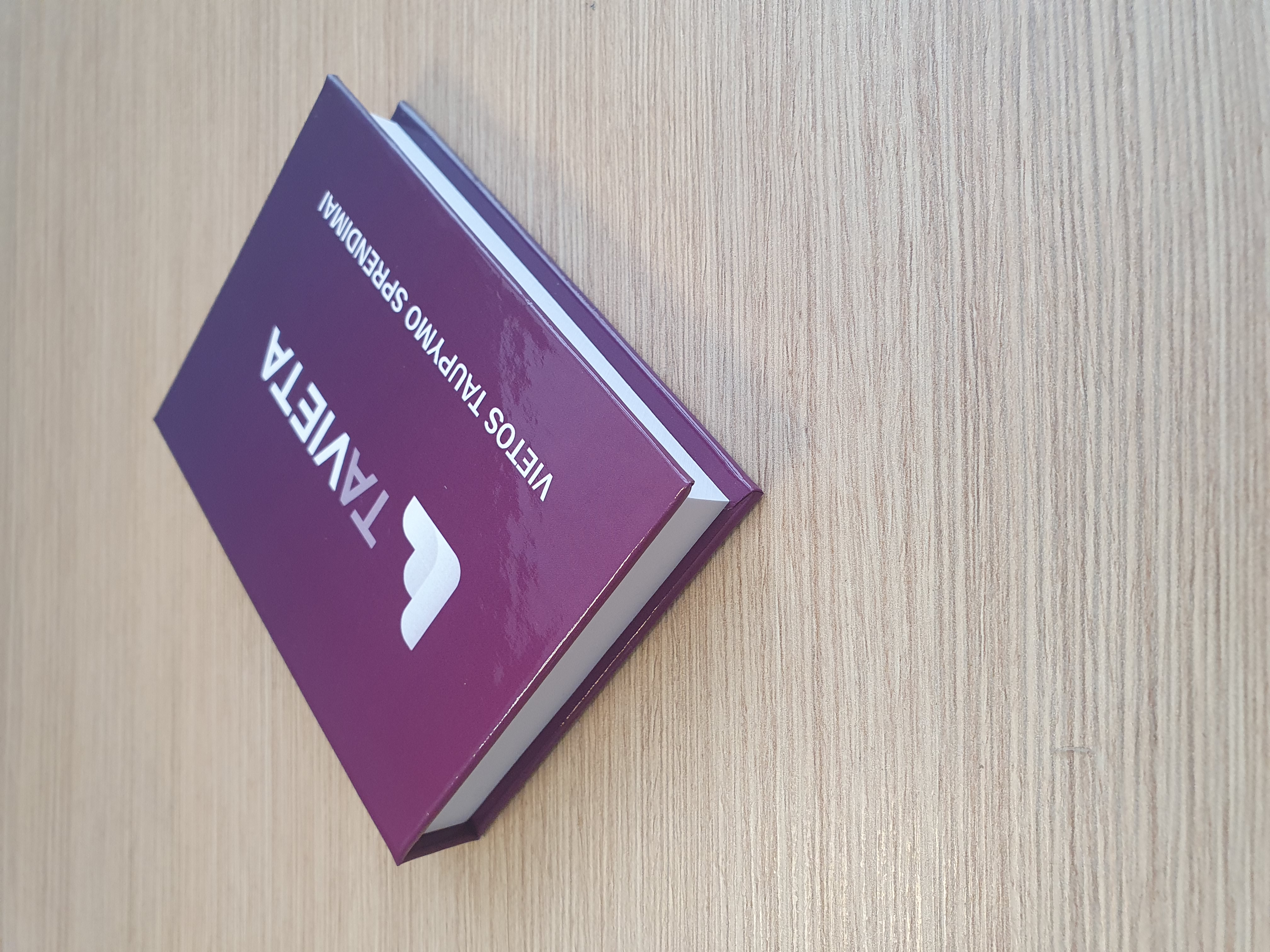 Adhesive note pads in hard cover books