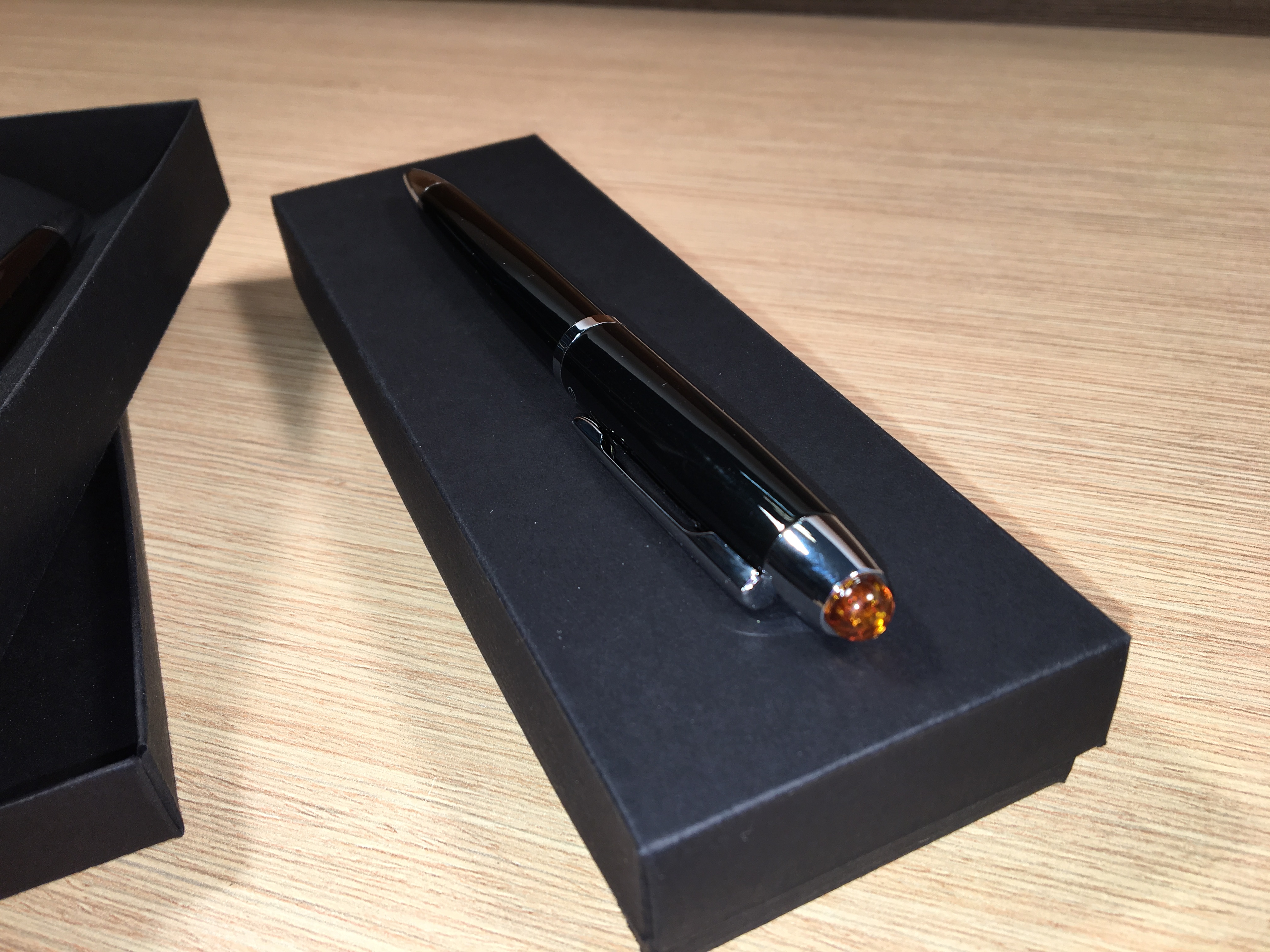 Pen with amber