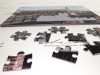 Delionės Puzzle su reklama