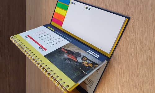 Hard cover calendar with adhesive note pads